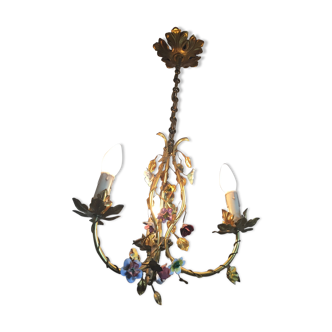 Golden metal chandelier with flowers