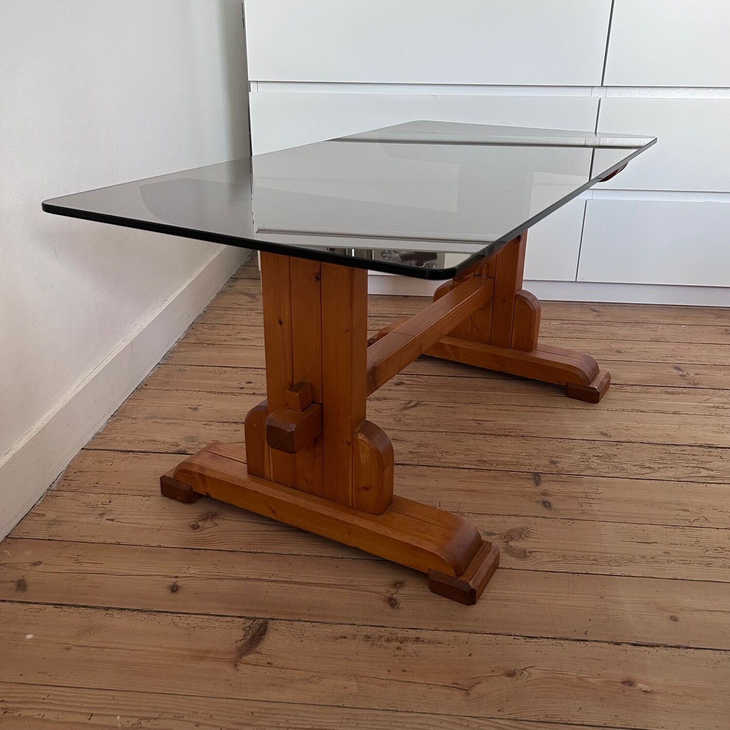 Pine coffee table with smoked glass top.