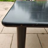 Old vintage wooden coffee table with tubular base