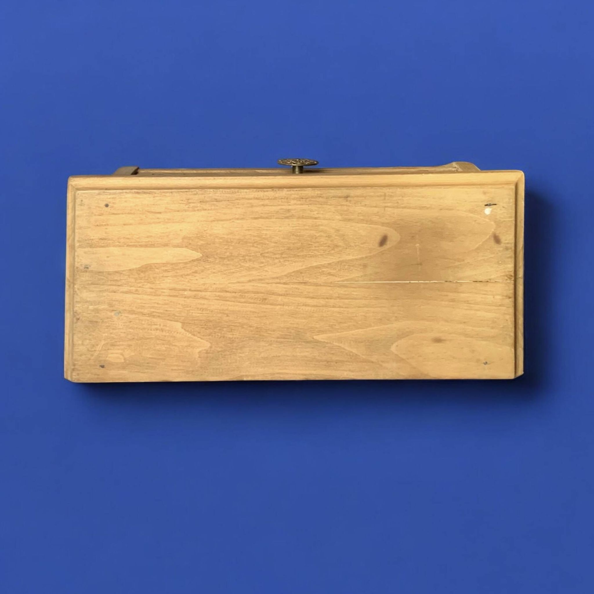 Old small hanging shelf in solid wood