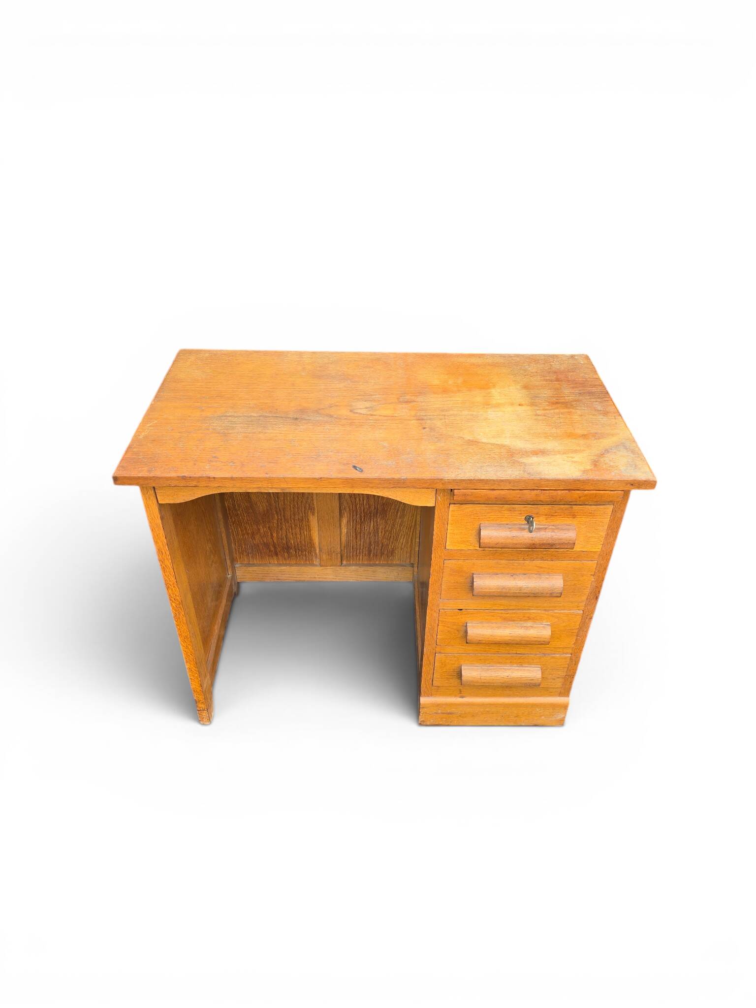 Vintage oak desk with a drawer unit and sliding shelf.