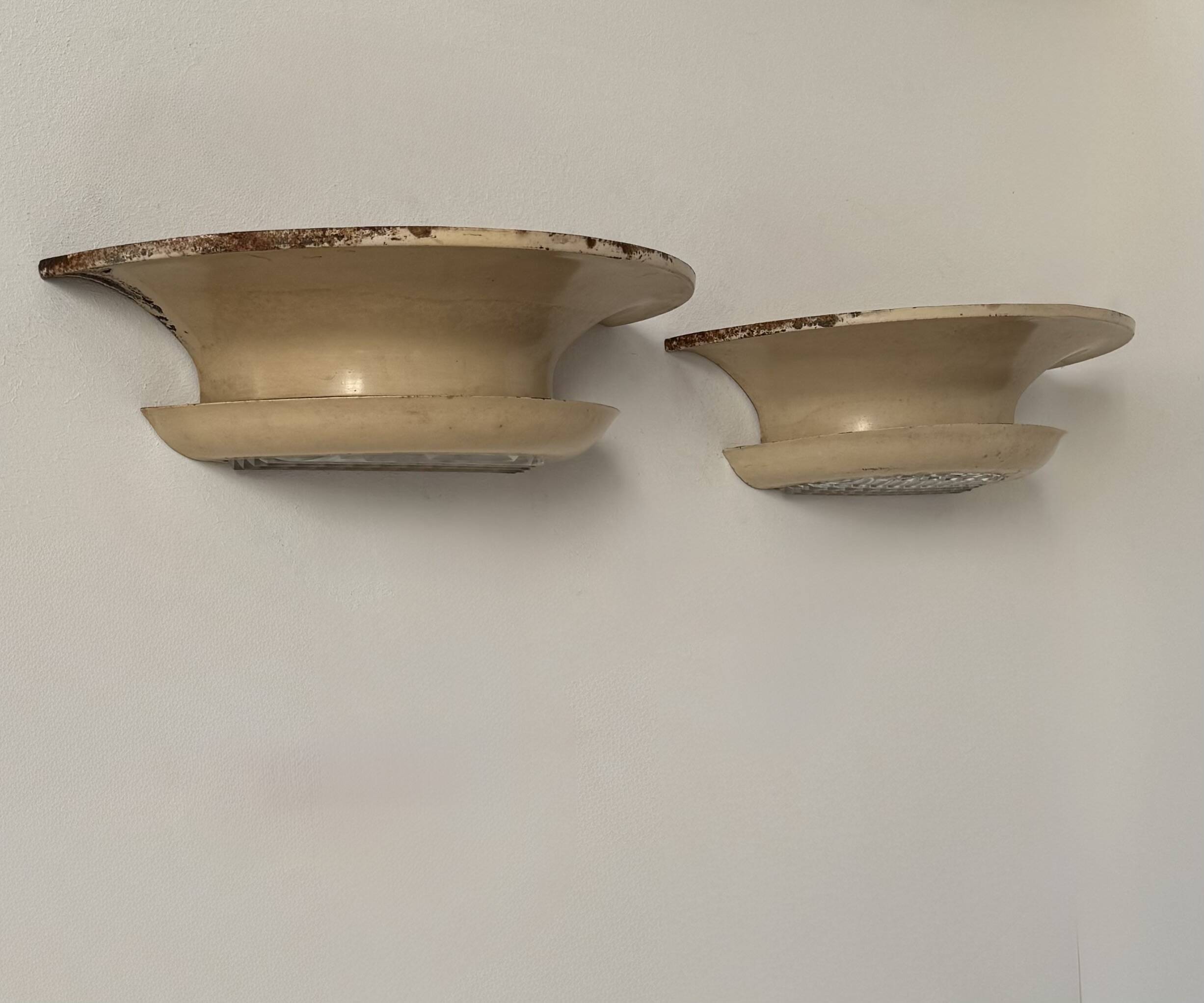 Pair of vintage modernist wall lights, beige painted metal and glass, France, 1930