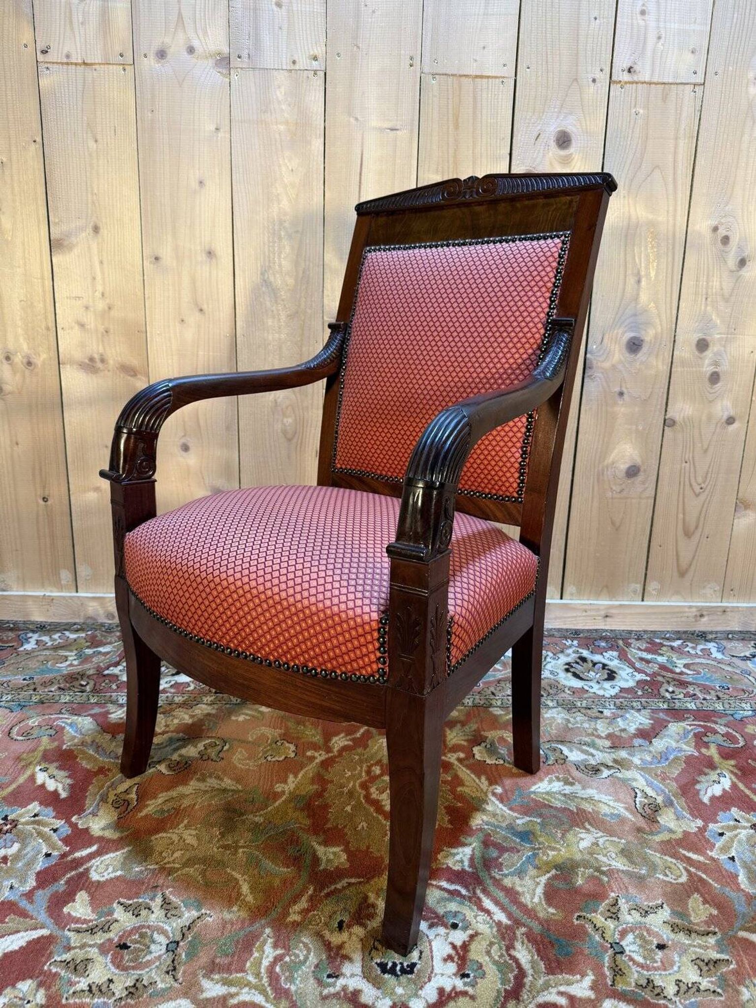 Fauteuil époque Empire en acajou pieds sabres