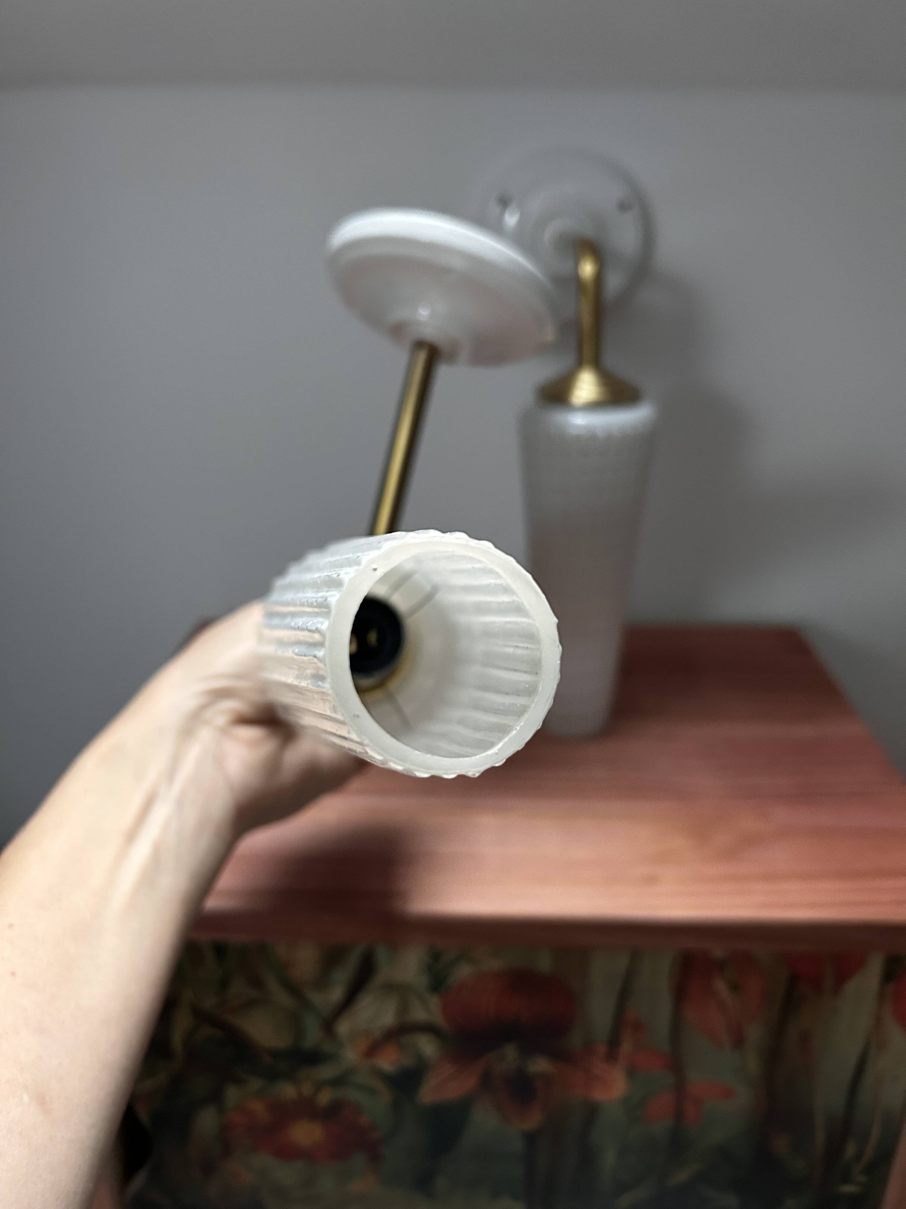 Pair of white and gold wall sconces