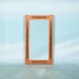 Vintage Danish wall mirror design from the 1960s in oak and stamped brass.