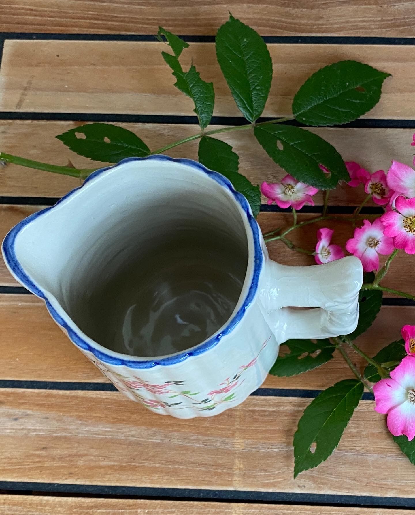 Small pitcher in iron earth with double old decoration