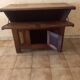 Old solid wood dough mixer carefully transformed into a bar cabinet.