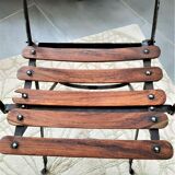 Folding garden chair with teak slats on a wrought iron structure