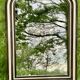 Louis Philippe mirror, wood and stucco with faux wood decoration. 19th century. 56 x 74.