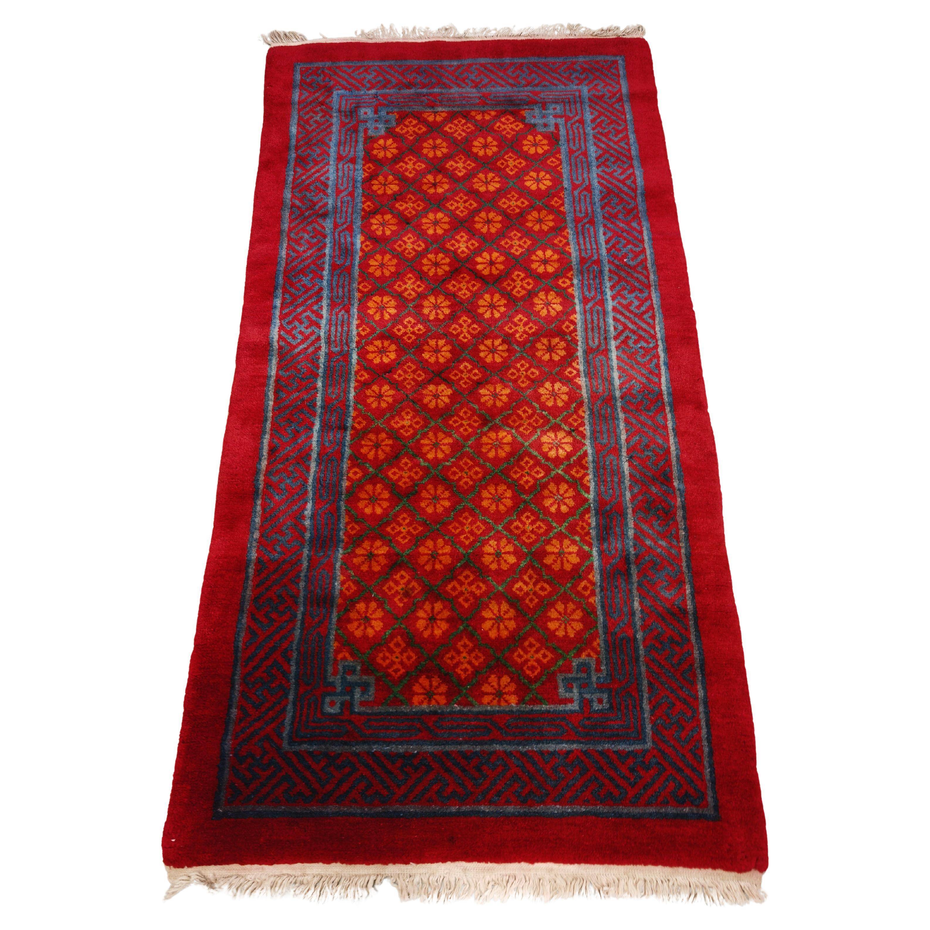 Ancient Khotan carpet, hand-knotted, floral pattern, Turkestan, 1960s.