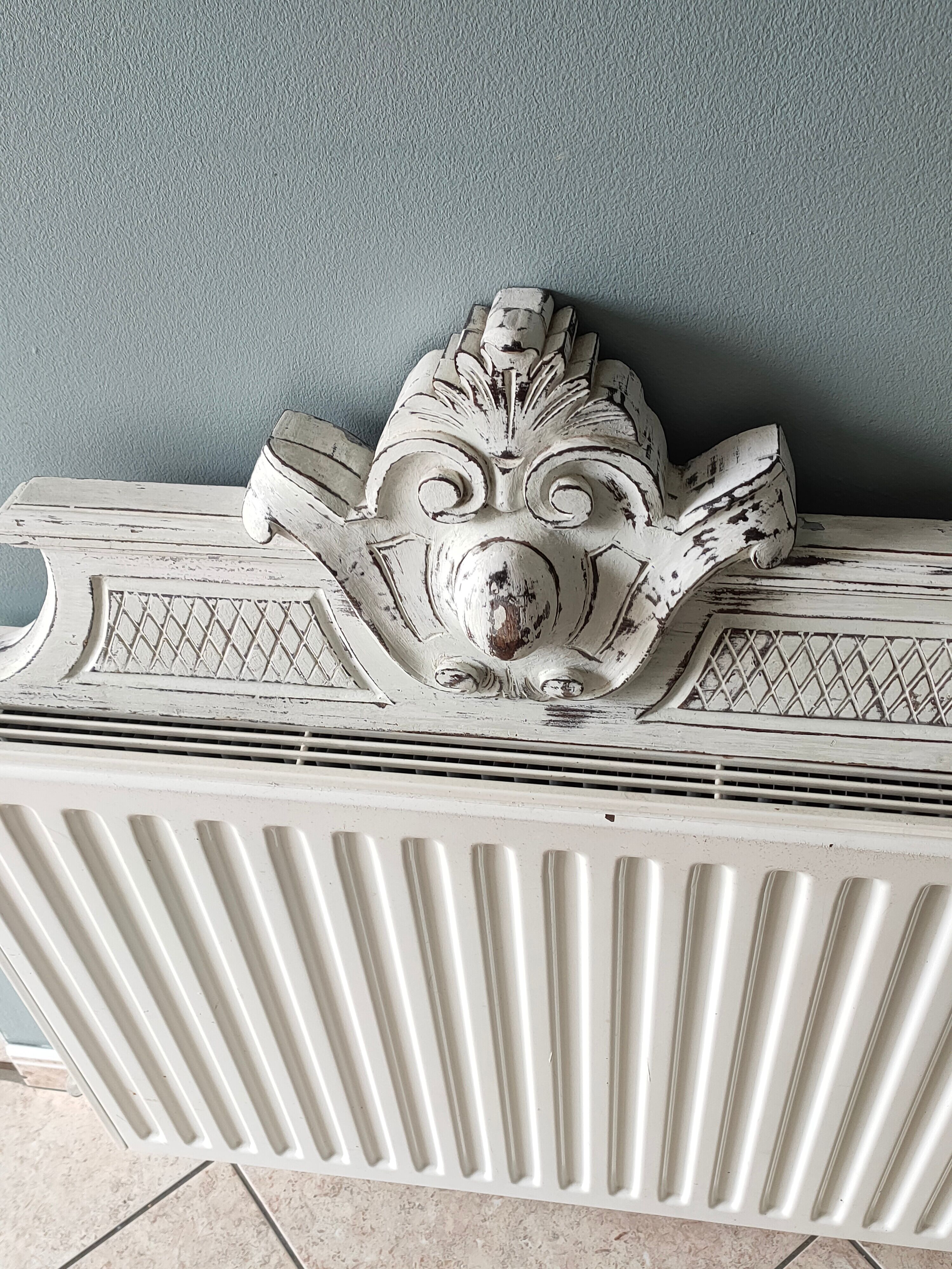 Old pediment in painted wood