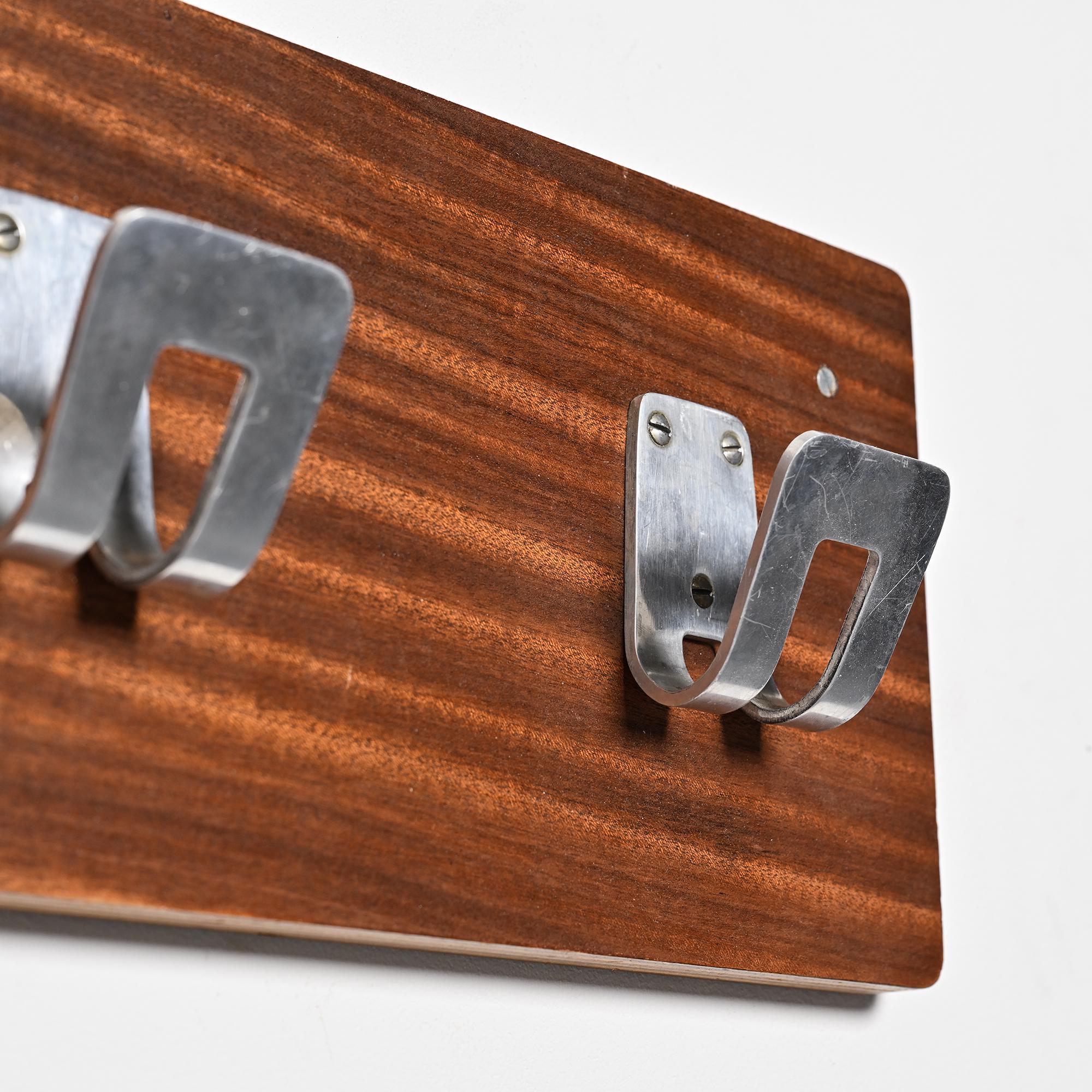Wall coat rack and lights by Pierre Guariche for La Plagne, around 1968.