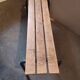Former vintage wooden school bench and metal tubes