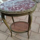 Old oval table with marble top, Louis XVI style