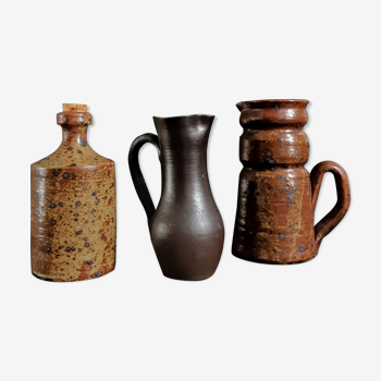 Trio of jugs and sandstone bottle