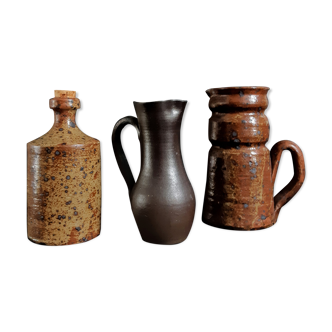 Trio of jugs and sandstone bottle