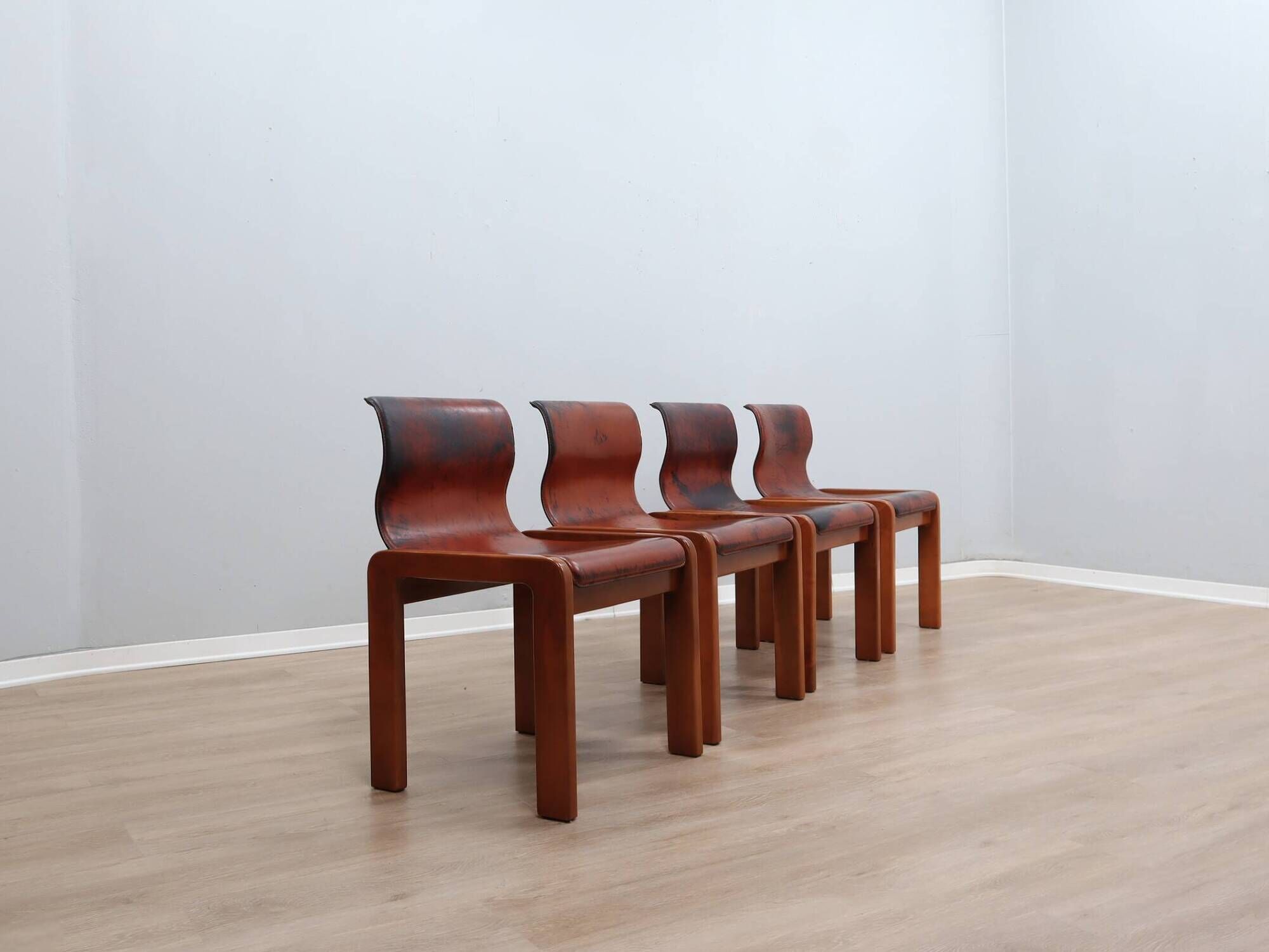 Curved wooden and leather chairs by Afra and Tobia Scarpa from the 1970s, set of 4.