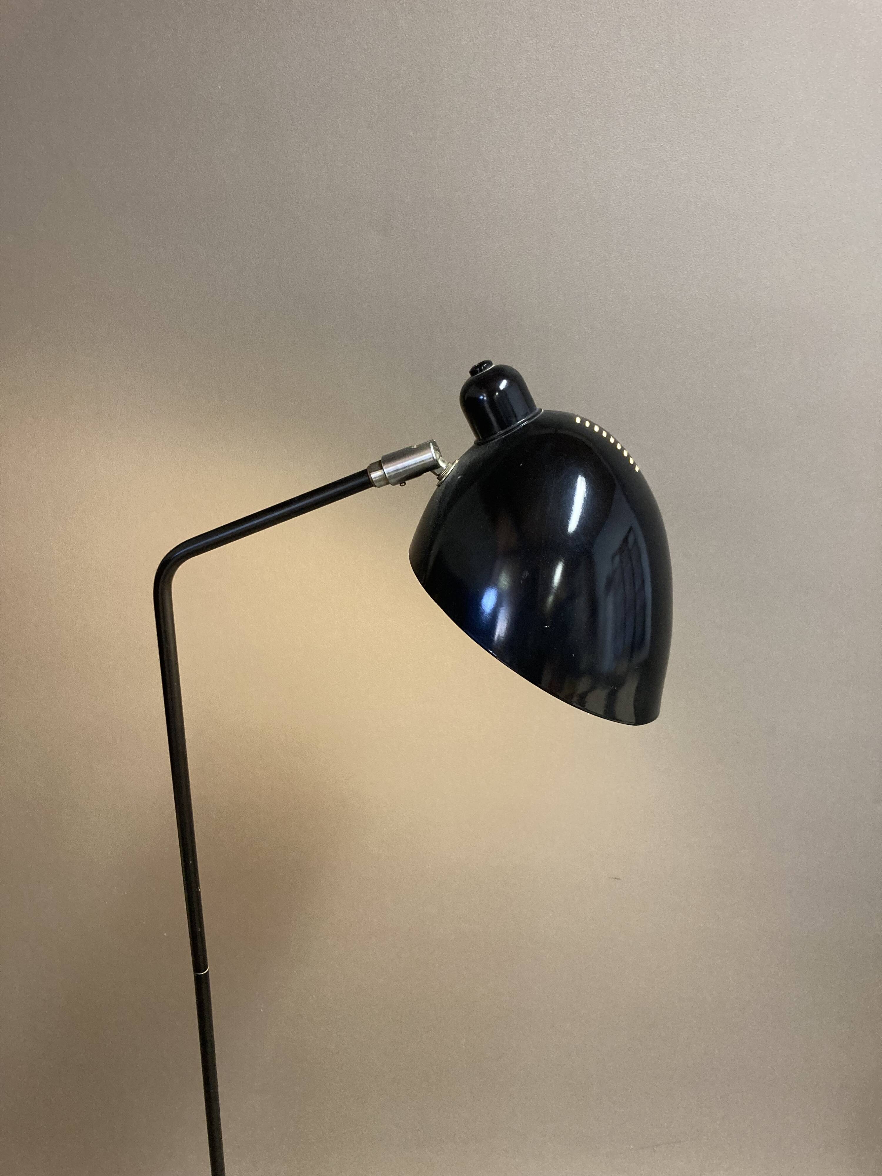 Black metal tripod floor lamp
