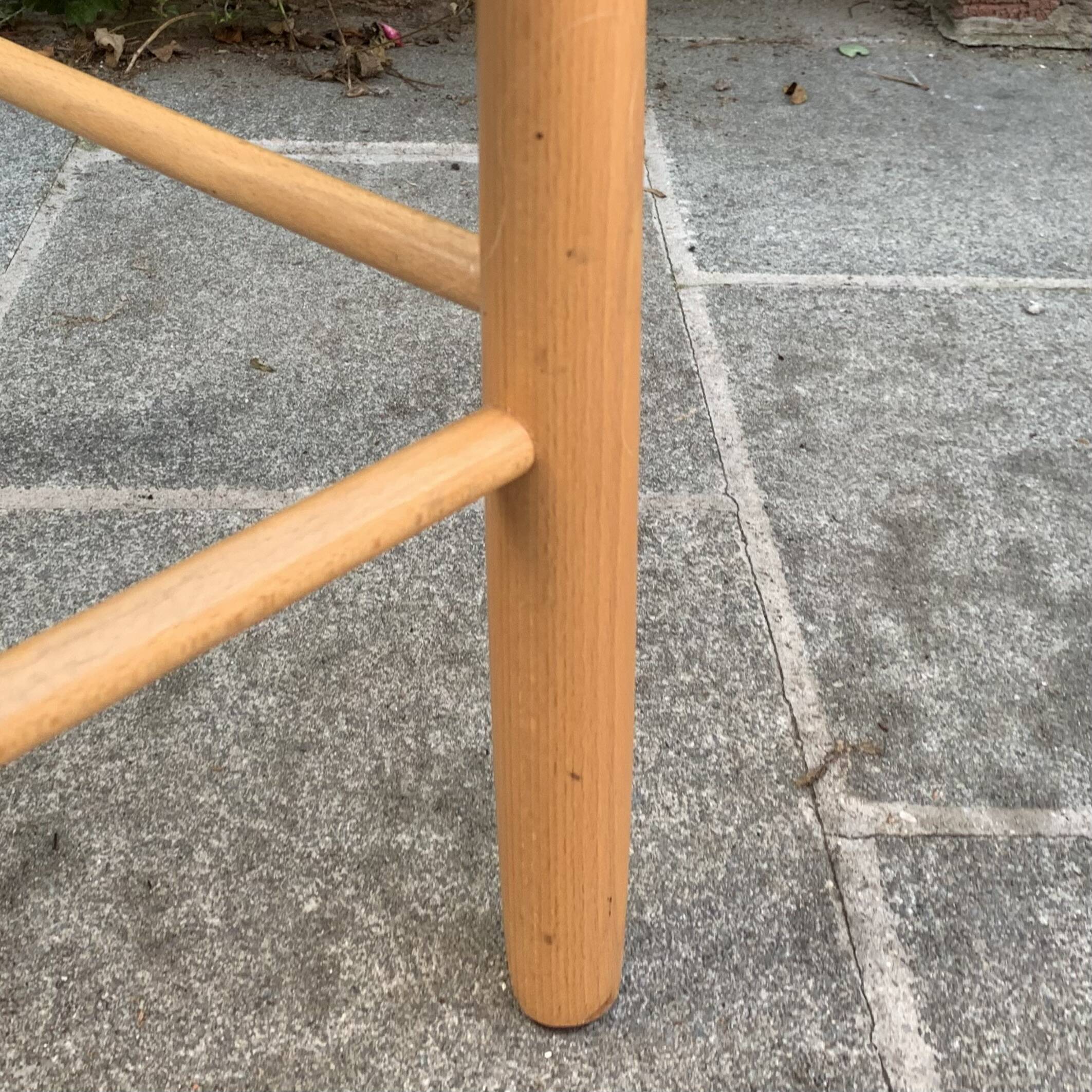 Old wooden and straw high chair for children