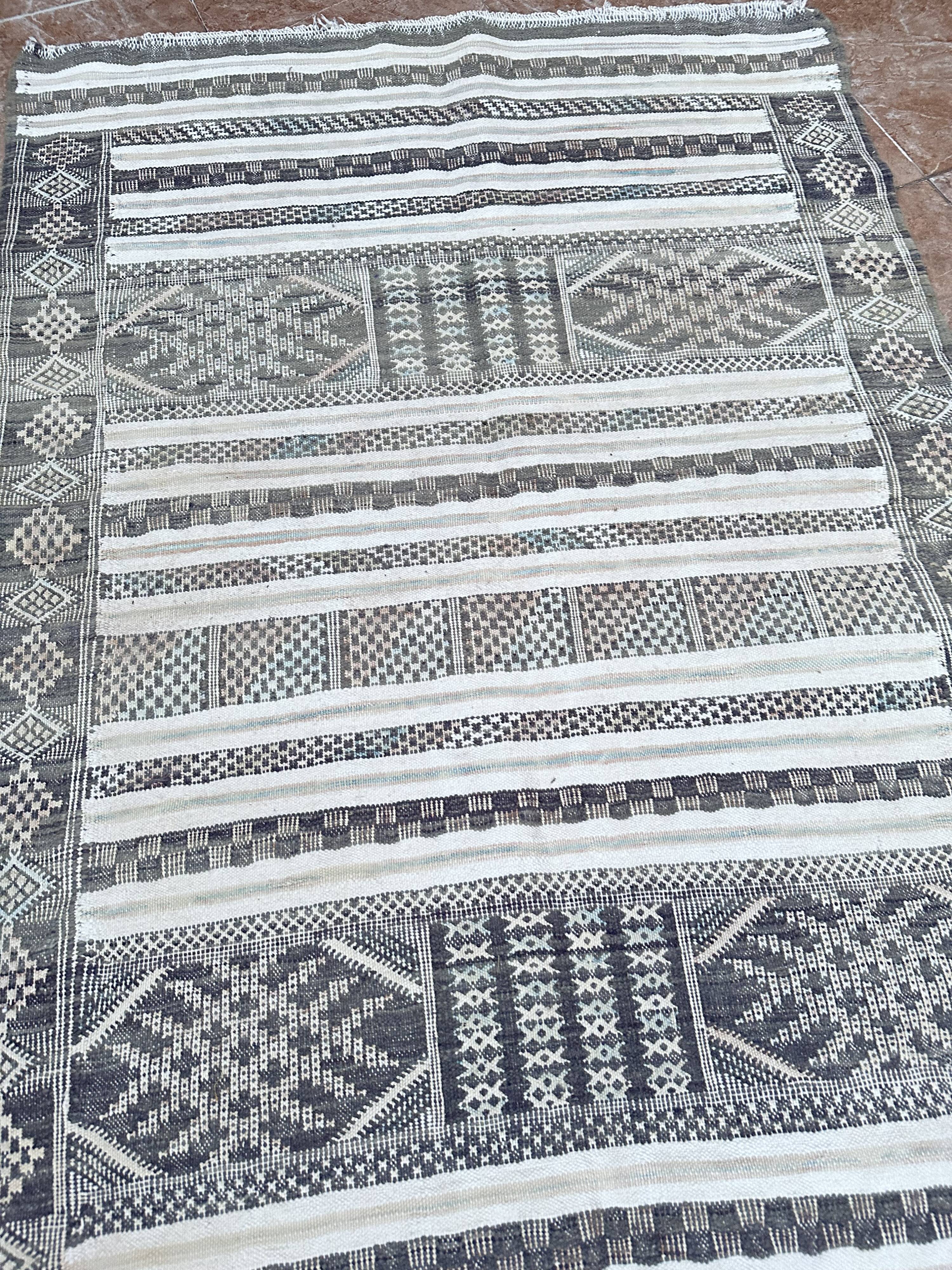 Handwoven Kilim rug made of camel wool, silk, and cactus.