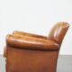 Cognac-colored antique sheep leather armchair