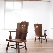 Pair of brutalist oak lounge chairs with rush seats, circa 1935
