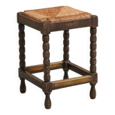 Solid oak stool, straw and brass from the 1920s.