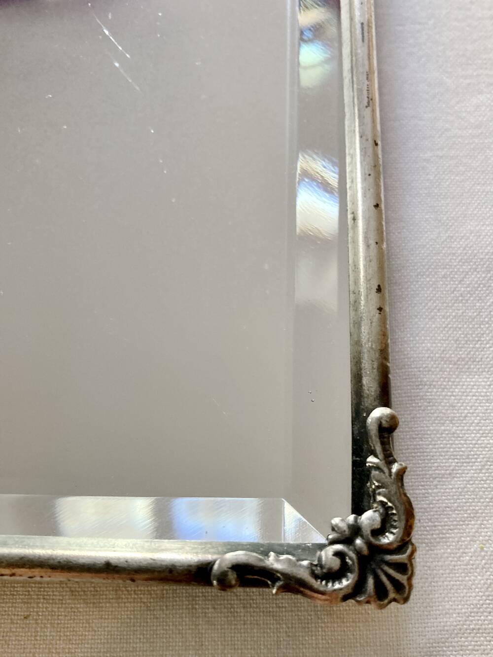 Antique framed mirror, bevelled glass and silver-plated metal frame, 1930-1940.