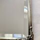 Antique framed mirror, bevelled glass and silver-plated metal frame, 1930-1940.