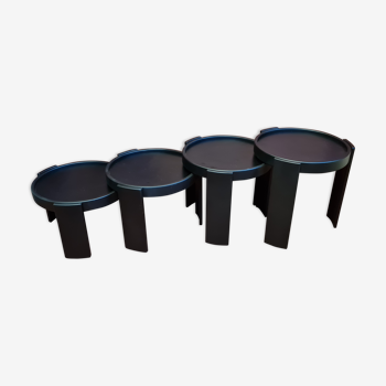 Suite of 4 black trundle tables from Cassina