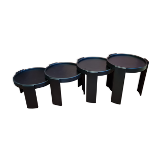 Suite of 4 black trundle tables from Cassina