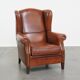 Fauteuil à oreilles de style anglais en cuir de vachette