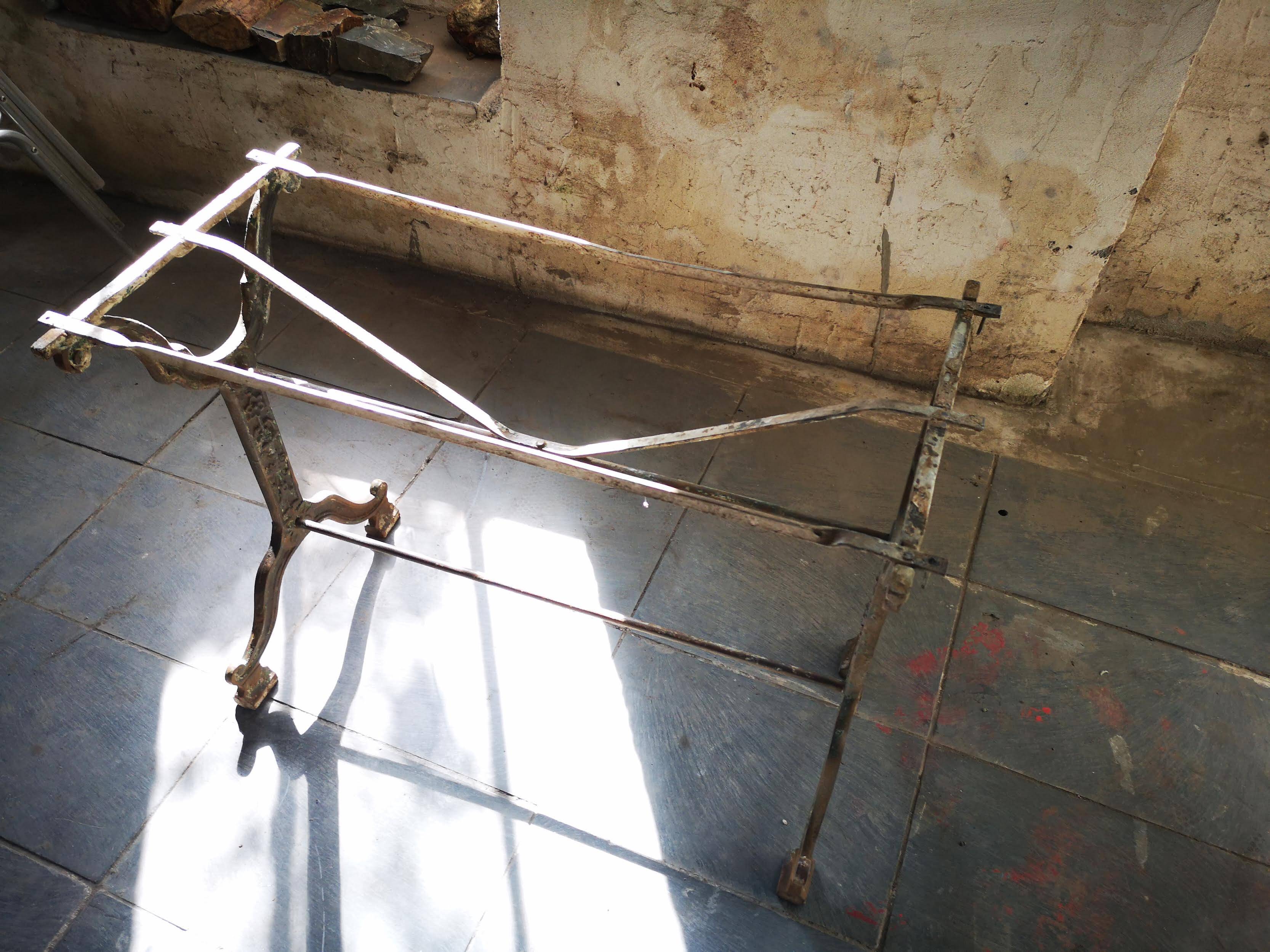 Old bistro table – cast iron legs and natural slate top