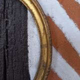 Golden oval frame