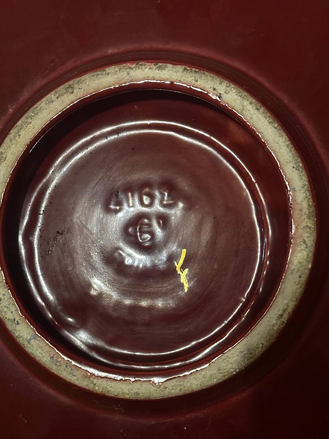 Burgundy and gold openwork plate in ceramic from Saint-Clement, 1950s.