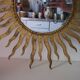 Miroir soleil en métal doré 54x54cm