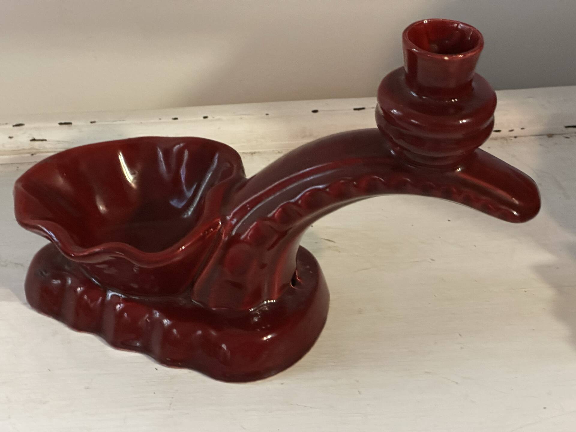 Ruby red ceramic pocket ashtray from Vallauris, numbered.