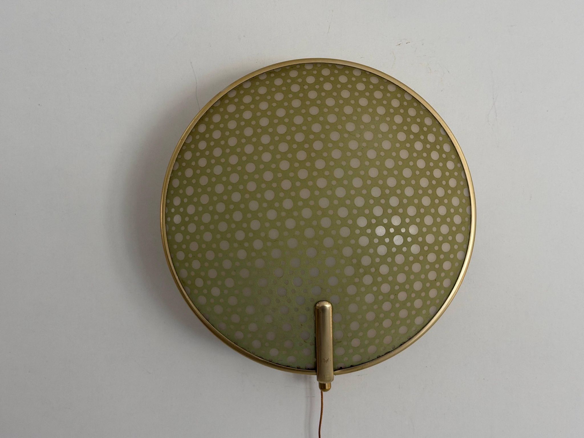 Pair of green plexiglass and gold metal wall lights by Erco, 1950s, Germany.