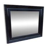 Black lacquered wood mirror "originally punctured"