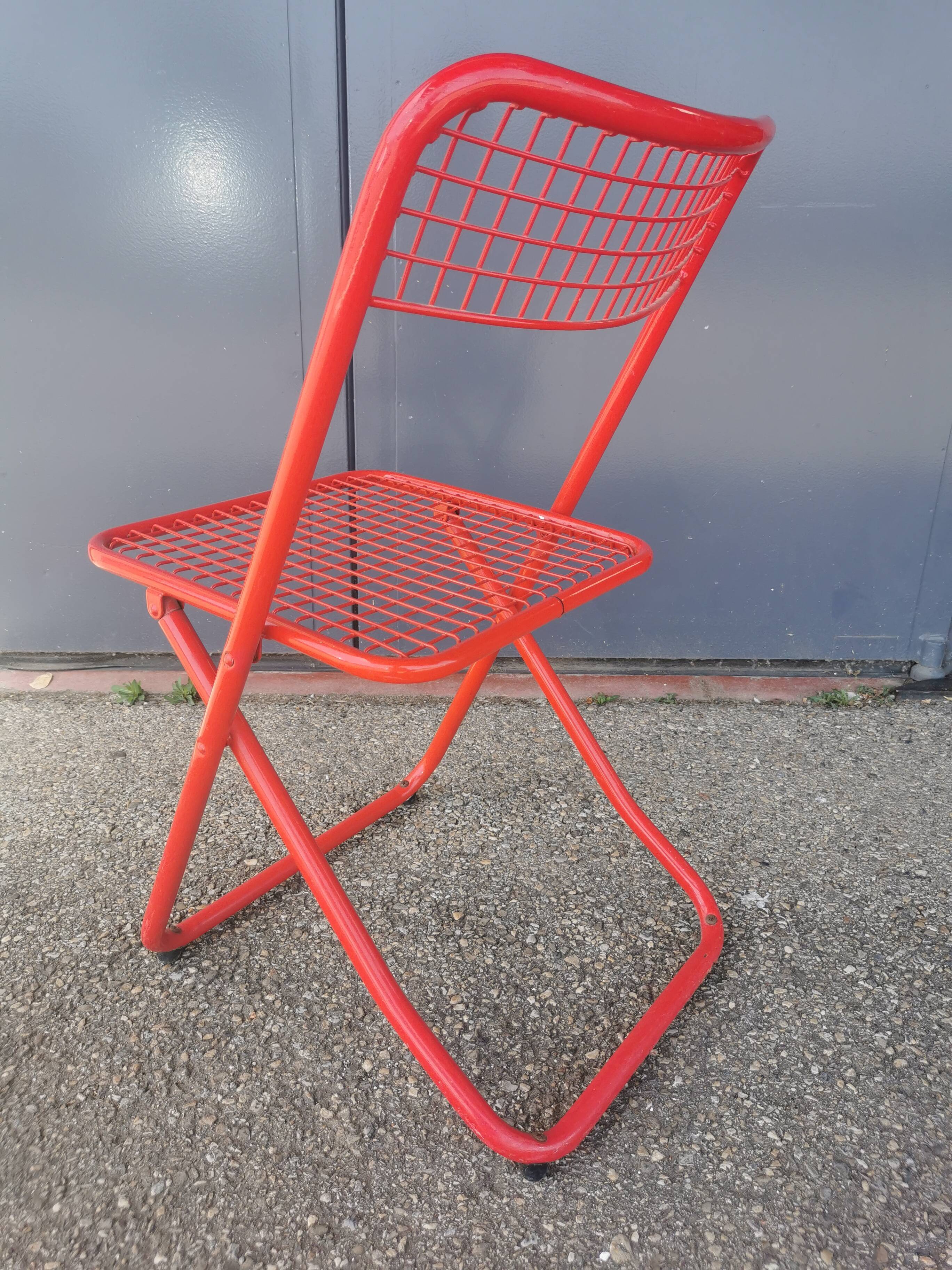 Vintage red metal folding chair