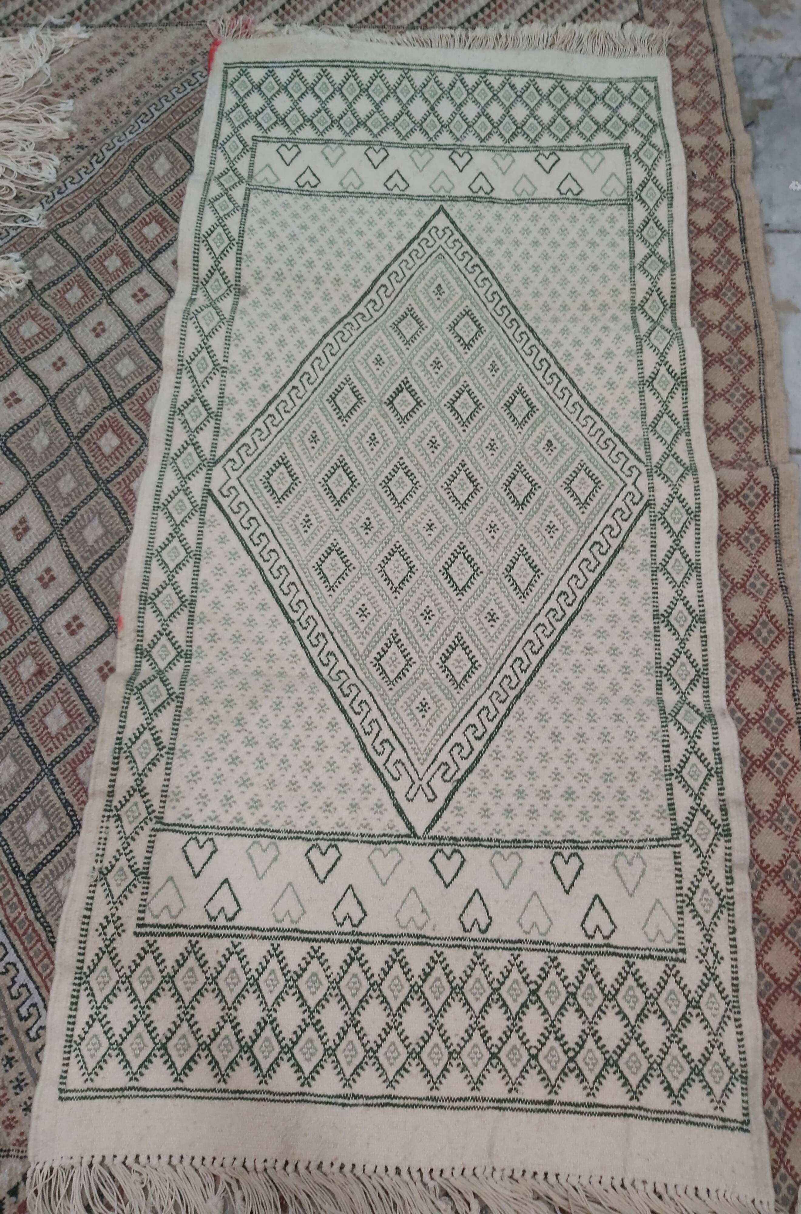 Traditional white and green carpet handmade in pure wool