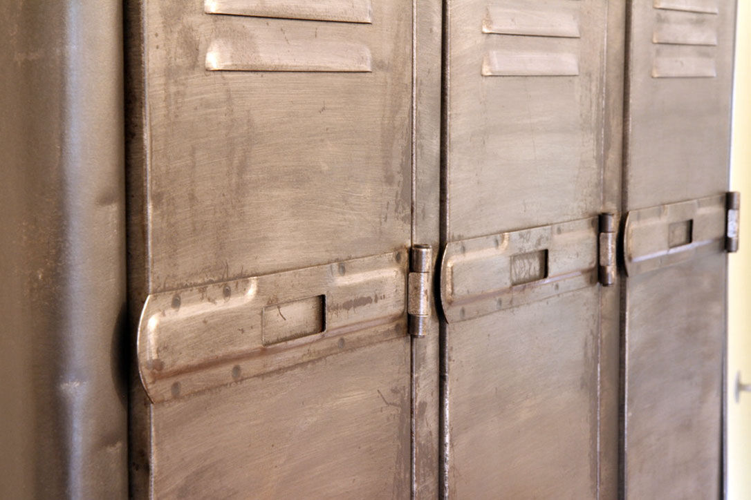 Industrial metal cloakroom with rounded corners.