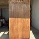 Very large freestanding teak mirror with an openwork carved pediment, Indonesia.