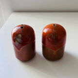 Salt and pepper shakers in orange stoneware
