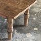 Brown Indonesian teak coffee table, with a border and cylindrical legs H40 L103.