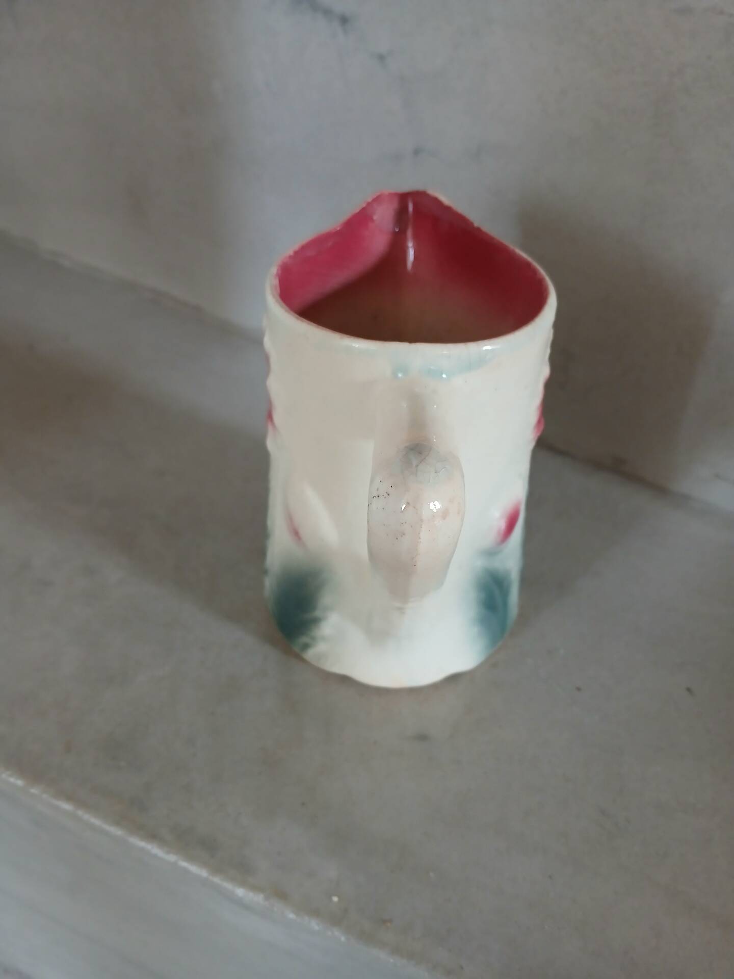 Small antique jug in slipware.
