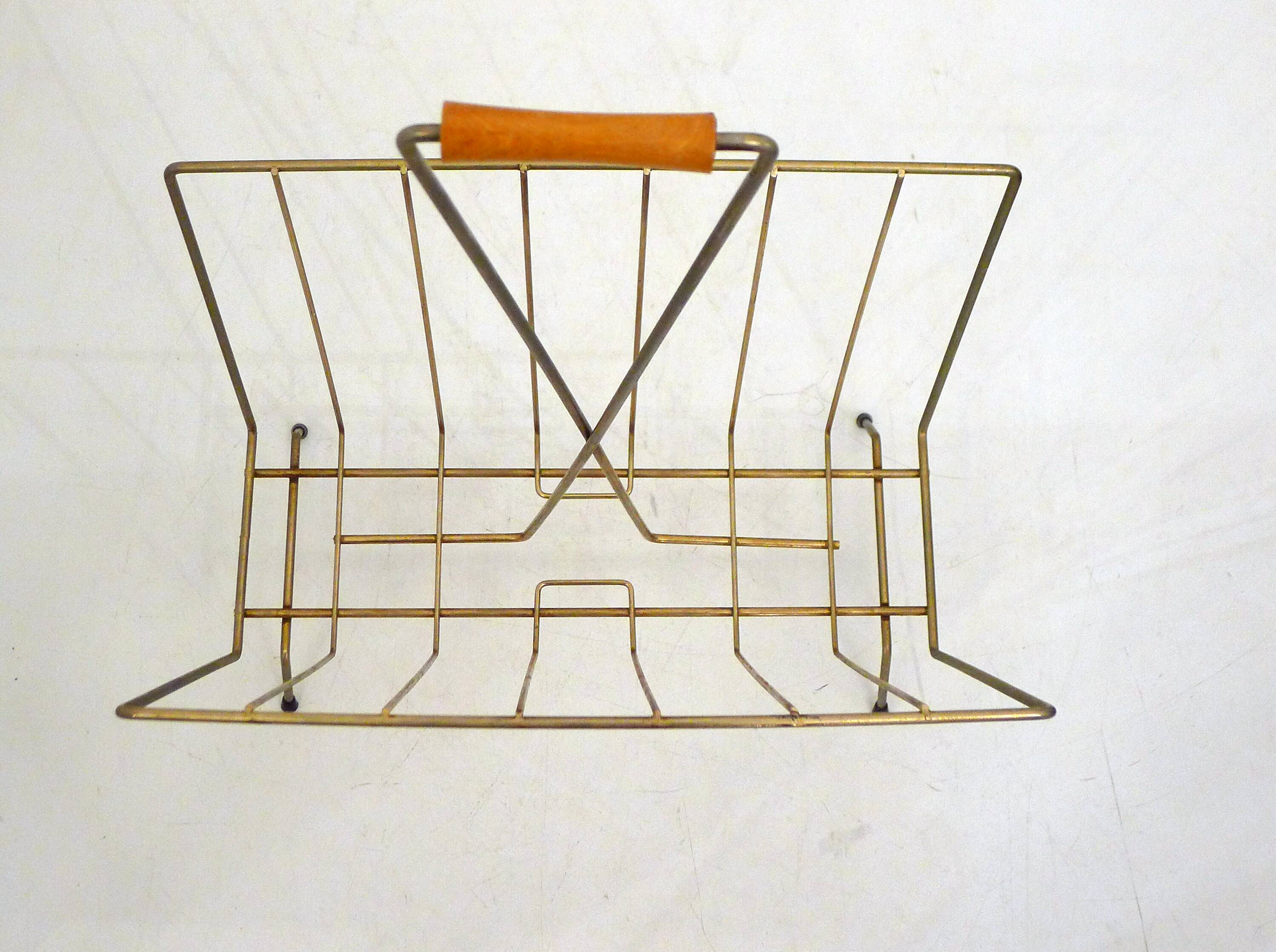 Mid-century openwork magazine rack, in gold metal & wooden handle.