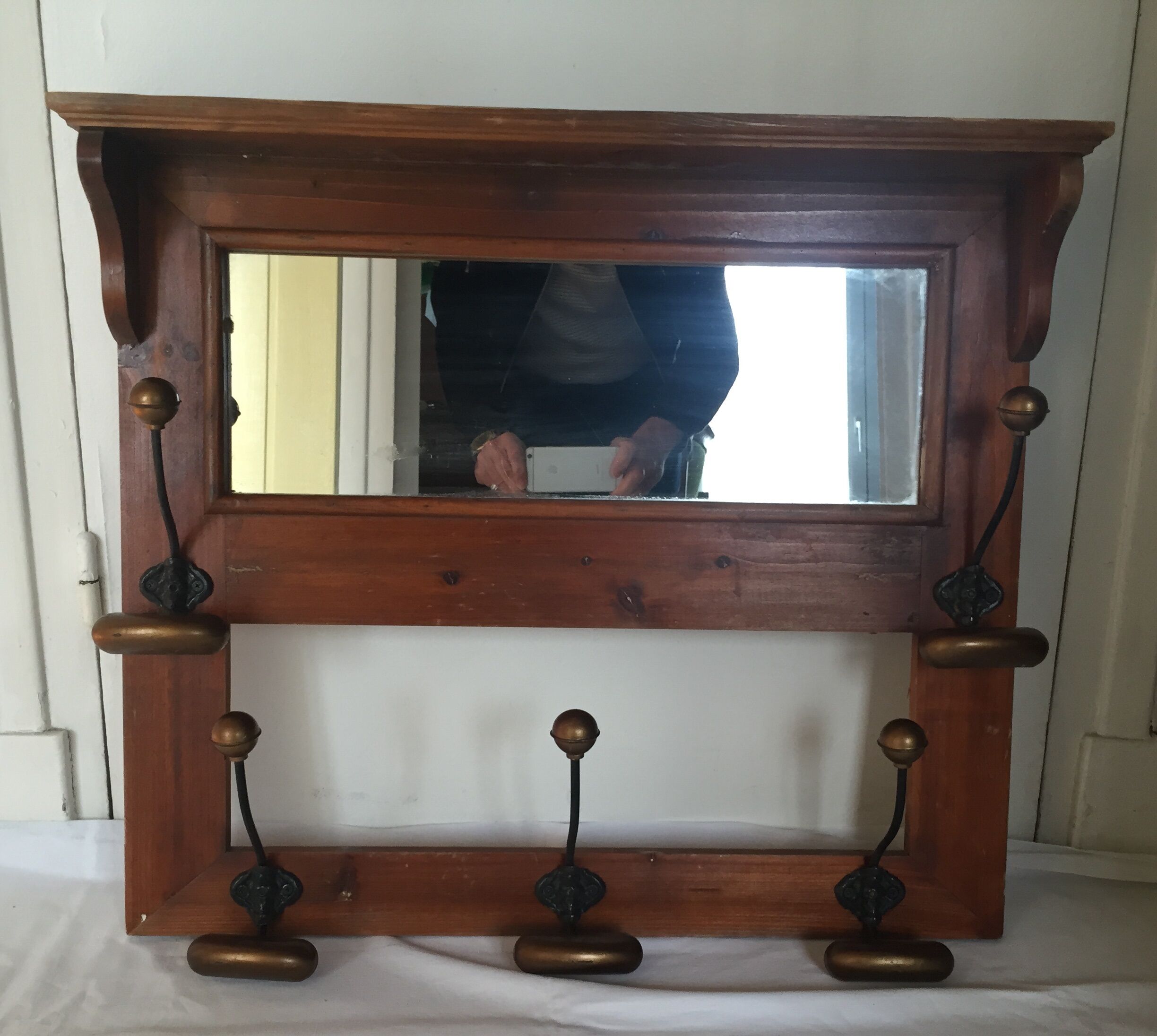 Old wood and brass coat rack