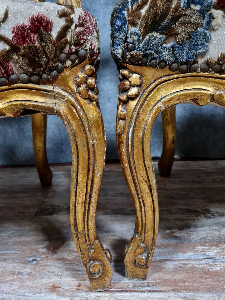 Pair of Louis XV style Baroque armchairs in gilded and carved wood circa 1900
