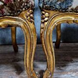 Pair of Louis XV style Baroque armchairs in gilded and carved wood circa 1900